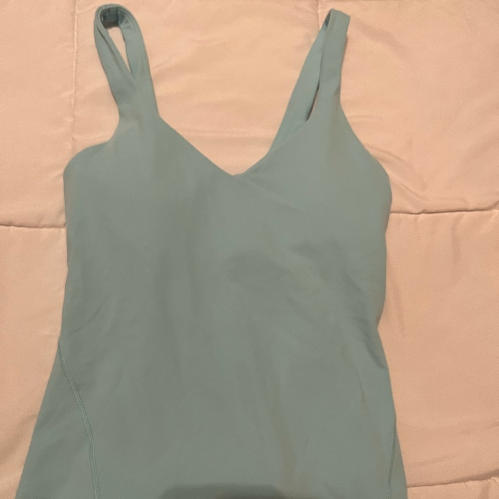 Three align tanks. The tan one is cropped and the blue and pink ones are not.